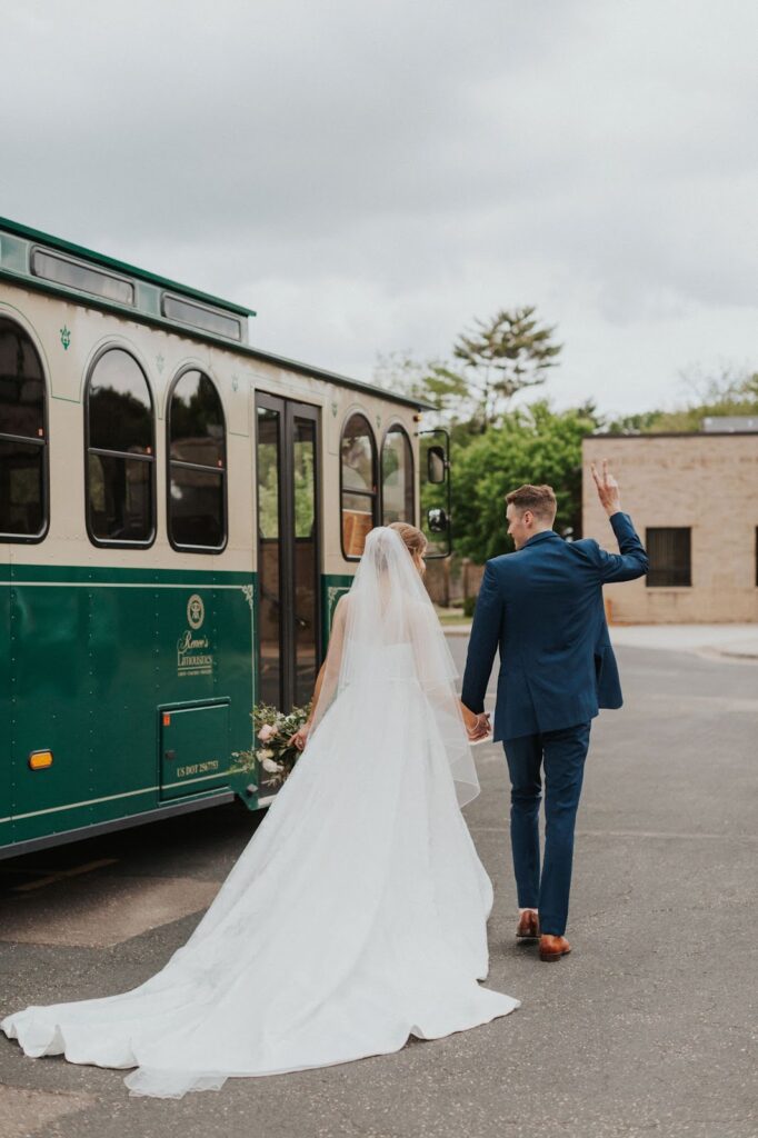 Bride and groom experience a trolley ride after getting married